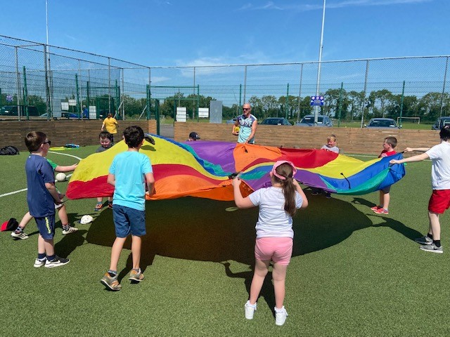 Children with a disability holding a parachute