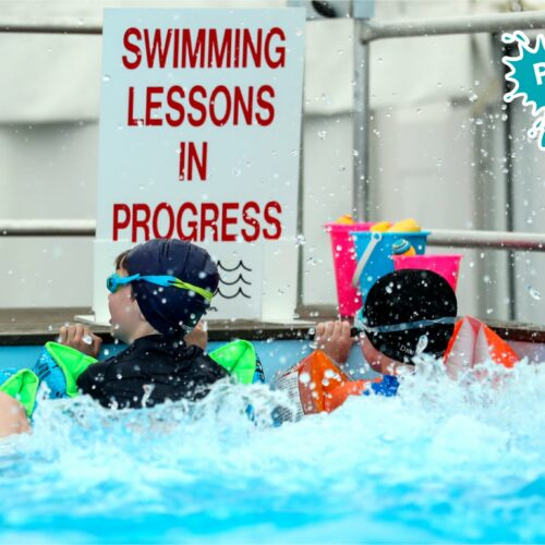 Kids learning to swim in pop up pool