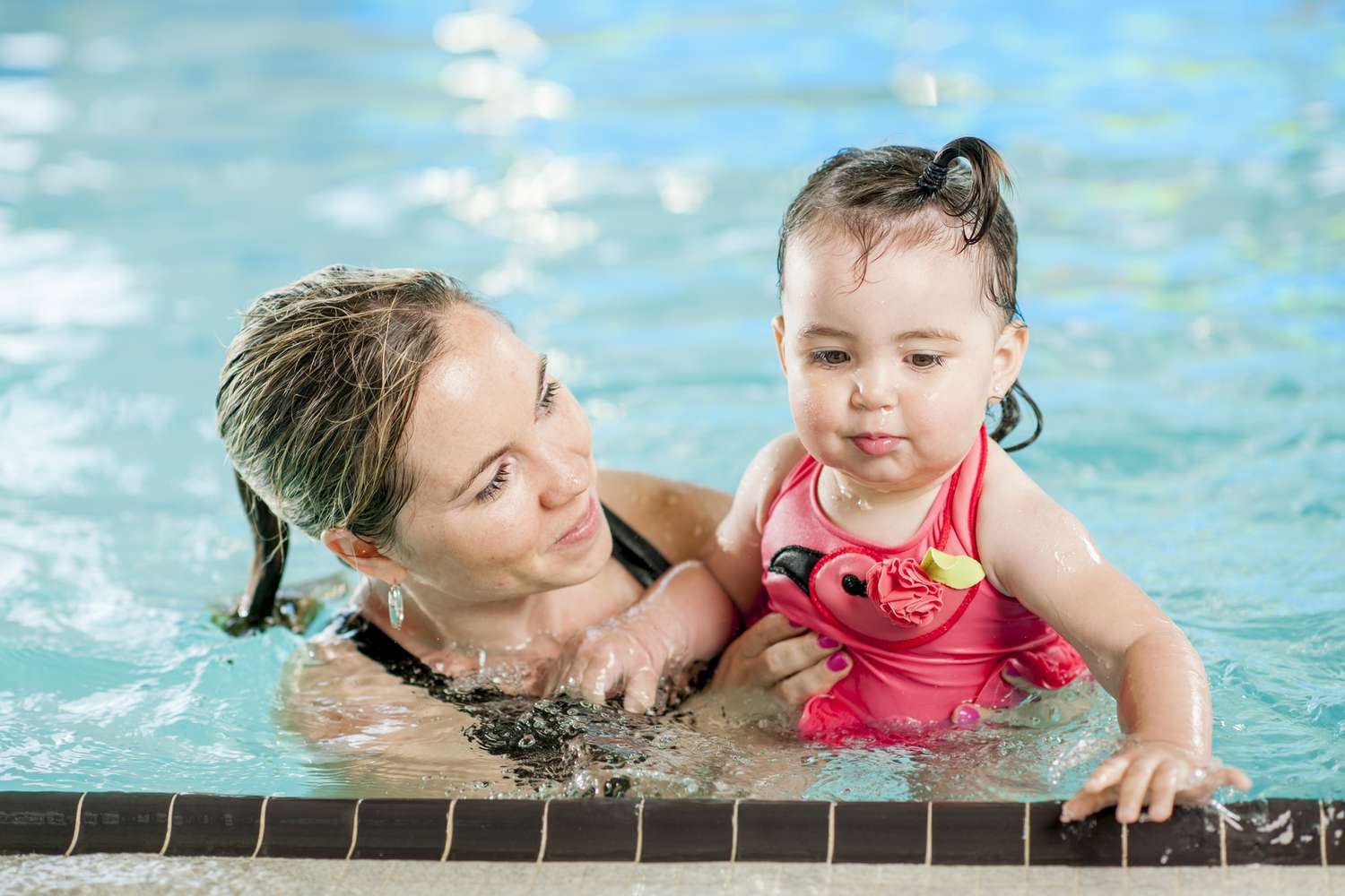 Mother and baby in swimming pool